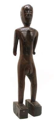 Lot 226 - A carved wood female fertility figure