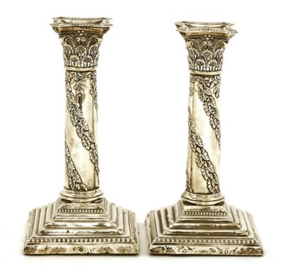 Lot 112 - A pair of Edwardian corinthian column candlesticks