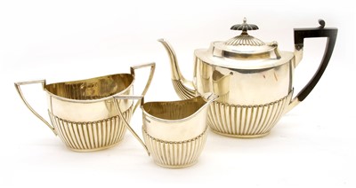 Lot 100 - A Victorian silver three piece tea set by Walker and Hall