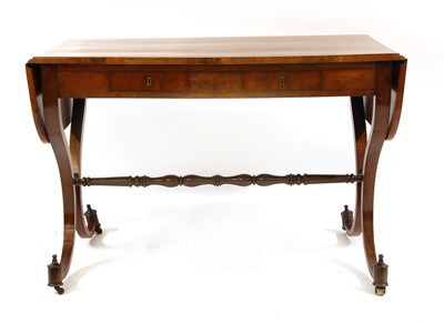 Lot 605 - A 19th century German flame mahogany sofa table