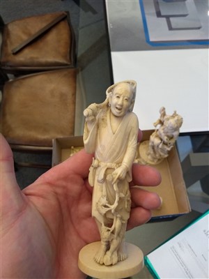 Lot 137 - A Japanese ivory okimono carved in the form of a Noh actor