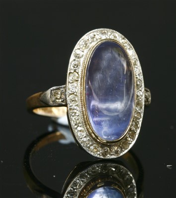 Lot 190 - A sapphire and diamond oval cluster ring
