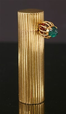 Lot 225 - An 18ct gold and silver emerald set Cartier lipstick holder, c.1950