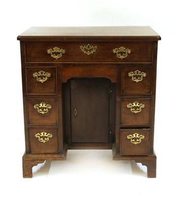 Lot 634 - A mahogany kneehole desk