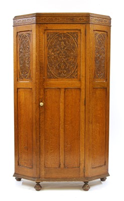 Lot 354 - An oak and carved hall robe