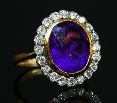 Lot 291 - An amethyst and diamond oval cluster ring