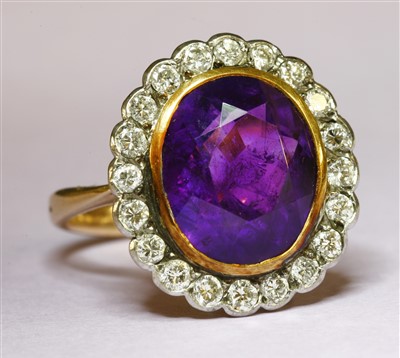 Lot 291 - An amethyst and diamond oval cluster ring