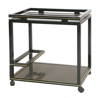 Lot 627 - A black and gold two tier trolley, by Pierre Vandel