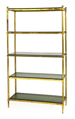 Lot 614 - A brass five-tier freestanding set of shelves