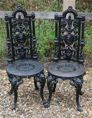 Lot 721 - A pair of Victorian cast iron garden chairs