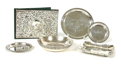 Lot 81 - A silver dish with flowerhead centre
