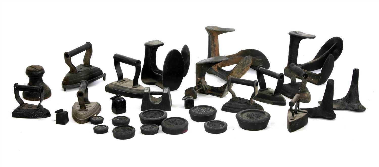 Lot 204 - A quantity of cast iron irons