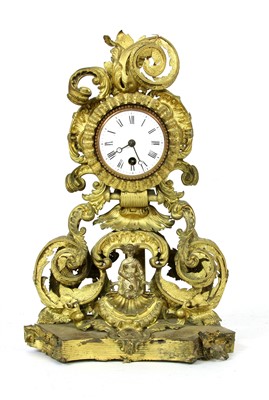 Lot 239 - A late 19th century pressed gilt metal mantel clock