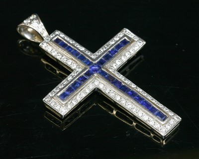 Lot 408 - A white gold sapphire and diamond Latin-style cross