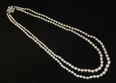 Lot 163 - A two row graduated natural saltwater pearl necklace