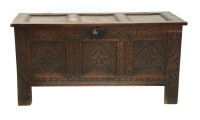 Lot 368 - A 17th century and later carved boarded chest