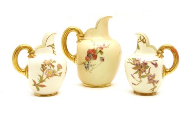 Lot 153 - A pair of Royal Worcester blush ivory flat back jugs