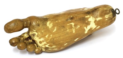Lot 113 - A carved wood foot