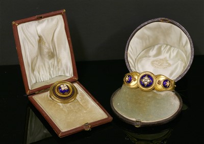 Lot 28 - A cased Victorian gold split pearl, diamond and enamel bangle, c.1860