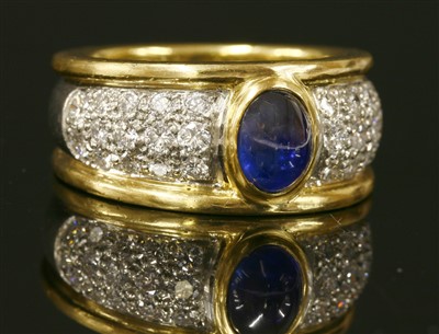 Lot 270 - A gentlemen's two colour gold sapphire and diamond ring