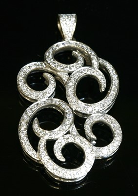 Lot 459 - A white gold diamond set scrolling pendant