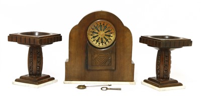 Lot 184 - A French walnut clock garniture