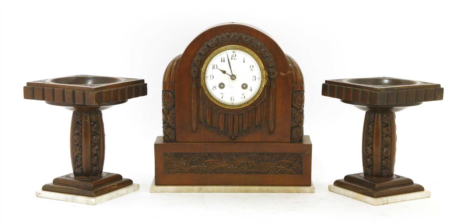 Lot 184 - A French walnut clock garniture