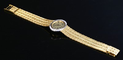 Lot 377 - A ladies' 18ct gold diamond set L U Chopard mechanical bracelet watch, c.1970