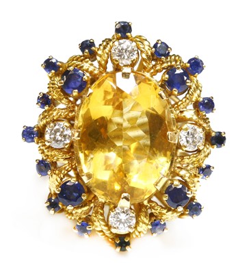 Lot 233 - A Continental gold citrine, sapphire and diamond cocktail ring, c.1950