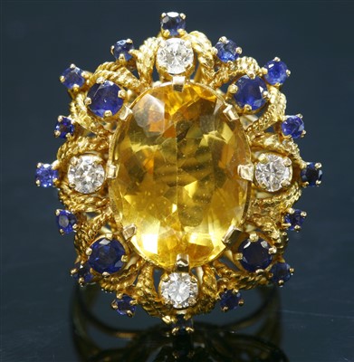 Lot 233 - A Continental gold citrine, sapphire and diamond cocktail ring, c.1950
