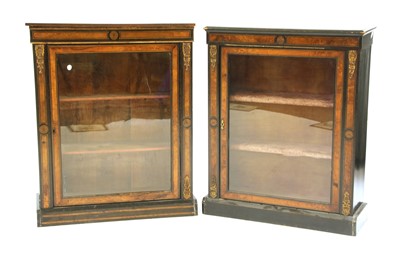 Lot 655 - A pair of Victorian walnut and ebonised pier cabinets
