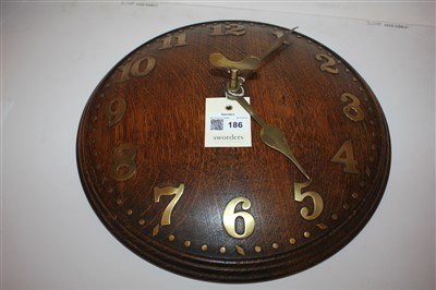 Lot 186 - An Heal's oak convex wall clock