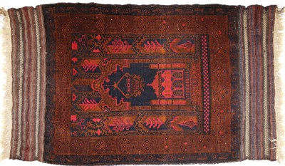 Lot 702 - A Belouch prayer rug