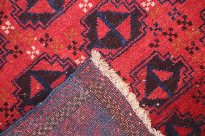 Lot 286 - A Bokhara type rug with rust coloured ground