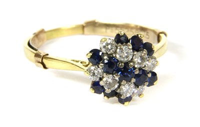 Lot 87 - A sapphire and diamond cluster ring