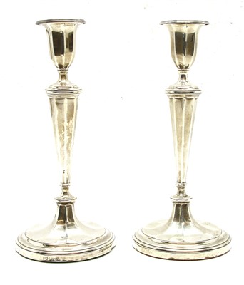 Lot 116 - A pair of hallmarked silver candlesticks