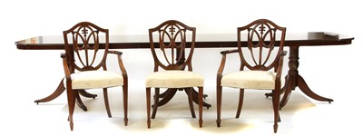 Lot 331 - A Regency style mahogany crossbanded triple pedestal table