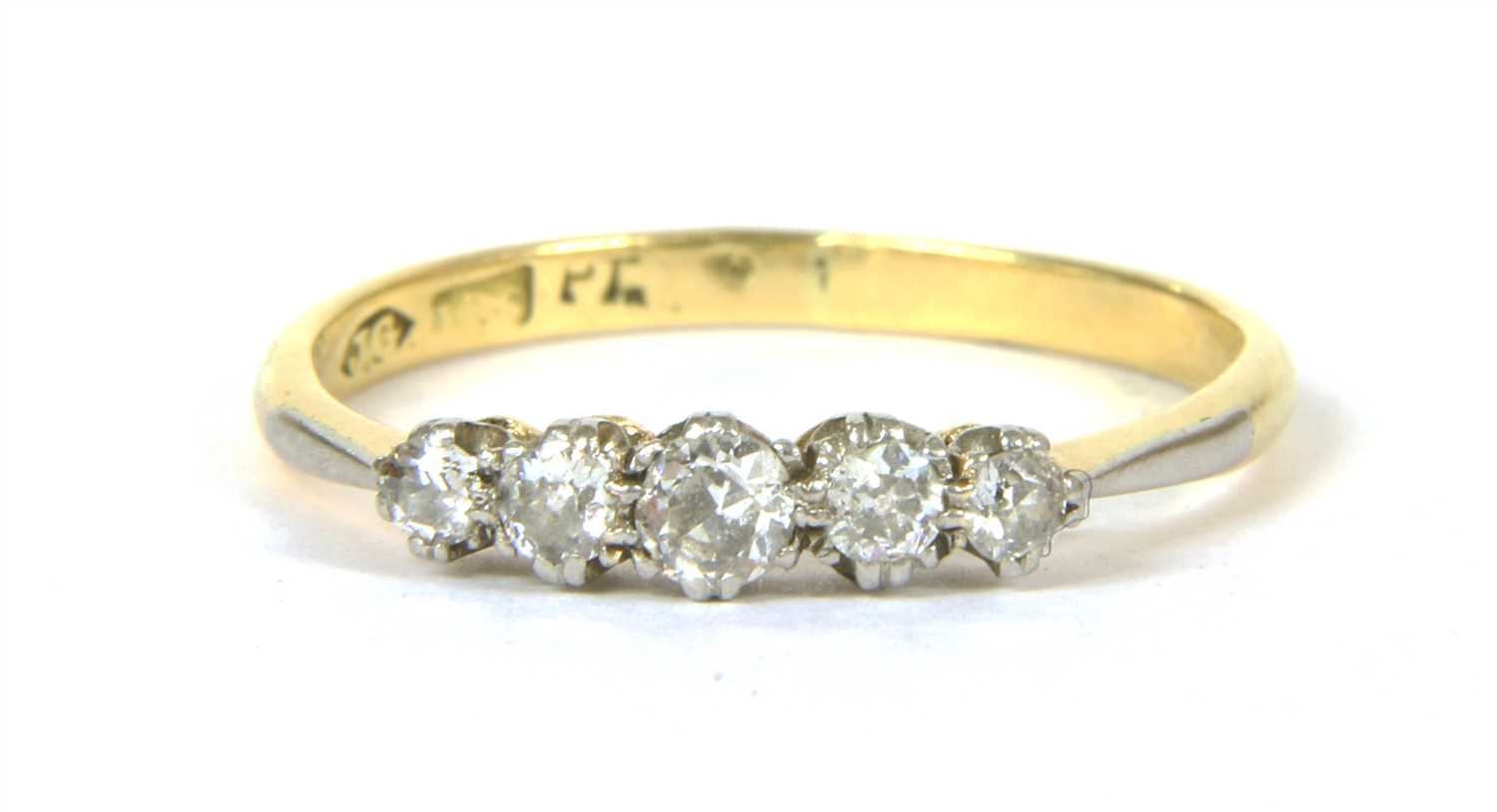 Lot 33 - A gold five stone diamond ring