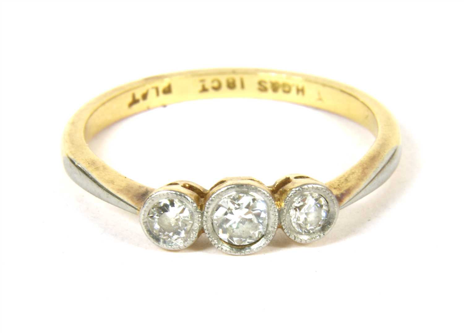 Lot 31 - A gold three stone diamond ring