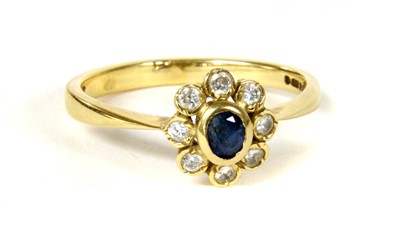 Lot 35 - An 18ct gold sapphire and diamond cluster ring