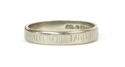 Lot 144 - An 18ct white gold flat profile wedding ring