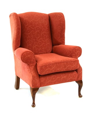 Lot 640 - A modern wing back armchair