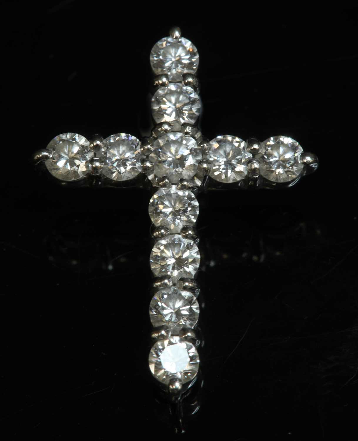 Lot 465 - An 18ct white gold diamond set Latin cross