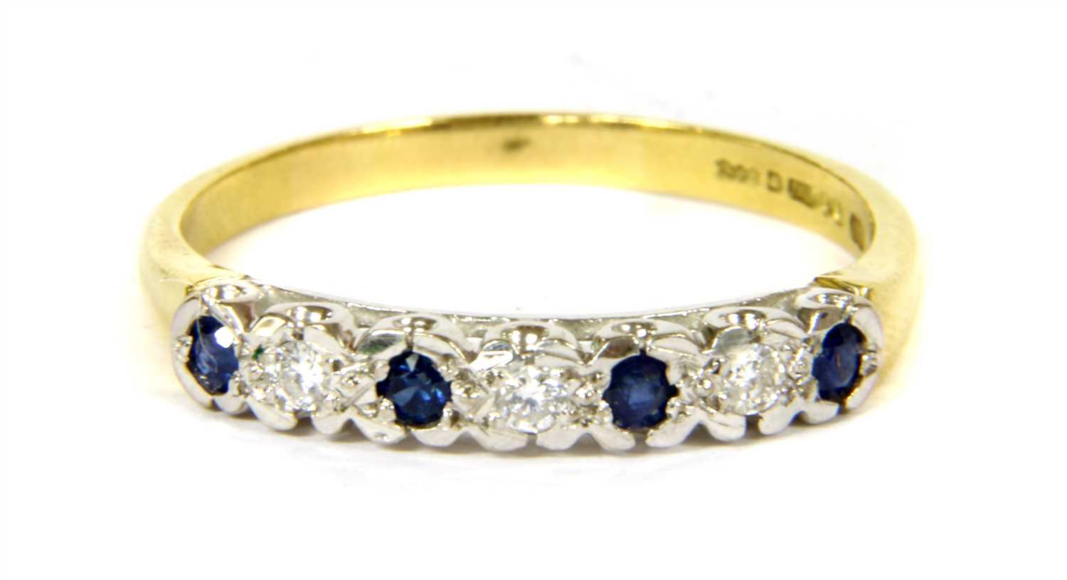 Lot 137 - An 18ct gold sapphire and diamond half eternity ring