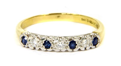 Lot 137 - An 18ct gold sapphire and diamond half eternity ring