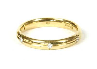 Lot 123 - An 18ct gold diamond set wedding ring