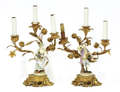 Lot 373 - A pair of gilt bronze three-branch candelabra