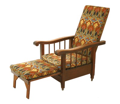 Lot 70 - An oak lounge armchair