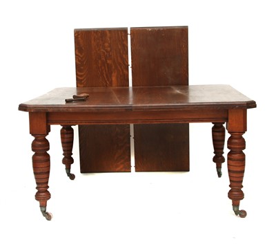 Lot 641 - An oak dining table