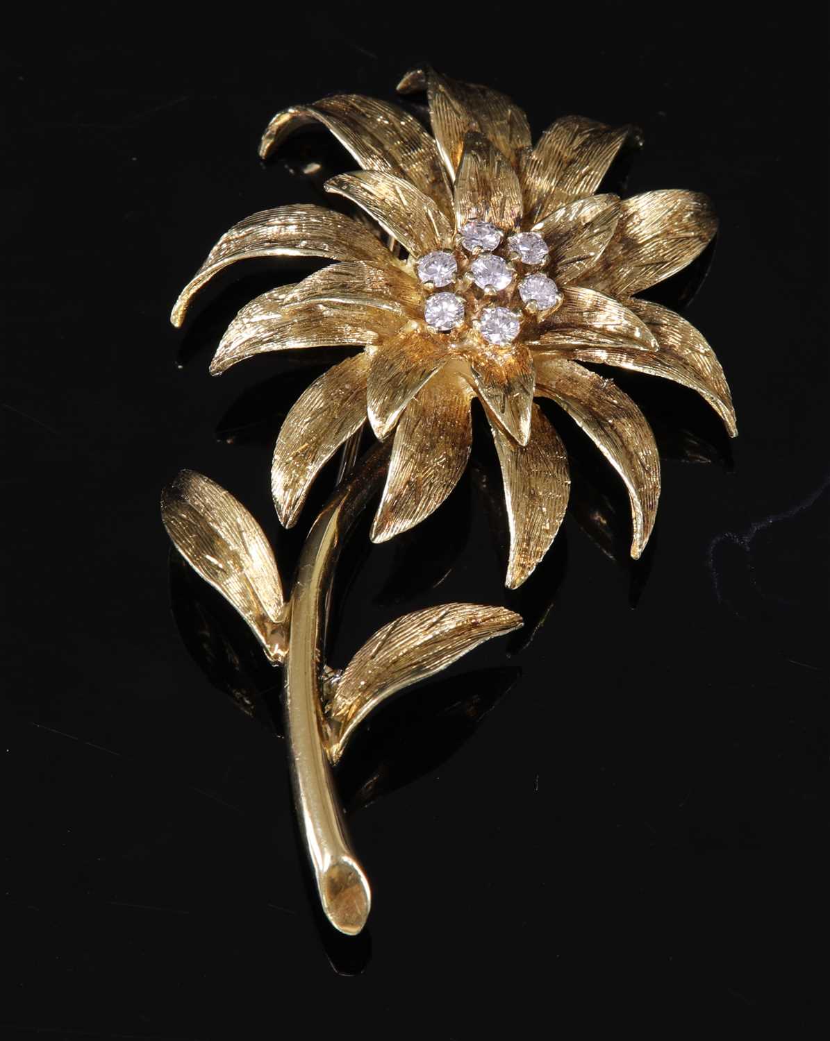 Lot 242 - An 18ct gold diamond set flower brooch, c.1970